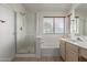 Bathroom with shower, bathtub and double vanity at 4248 E Raven Rd, Phoenix, AZ 85044