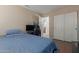 Bedroom with a double door closet and a view of the bathroom at 4248 E Raven Rd, Phoenix, AZ 85044