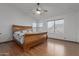 Main bedroom with wood flooring and ceiling fan at 4248 E Raven Rd, Phoenix, AZ 85044