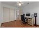 Home office with wood floors and ceiling fan at 4248 E Raven Rd, Phoenix, AZ 85044