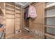 Large walk-in closet with ample shelving and hanging space at 4248 E Raven Rd, Phoenix, AZ 85044