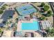 A clear aerial shot of the community pool, showcasing its size and proximity to the tennis courts and parking area at 4248 E Raven Rd, Phoenix, AZ 85044