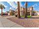 Two-story house with a tan exterior, two-car garage, and landscaped front yard at 4248 E Raven Rd, Phoenix, AZ 85044