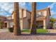 Two-story house with a tan exterior, two-car garage, and landscaped front yard at 4248 E Raven Rd, Phoenix, AZ 85044