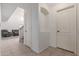 Home hallway with tiled floors and built-in shelving at 4248 E Raven Rd, Phoenix, AZ 85044