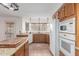 Kitchen with corner sink and wood cabinets at 4248 E Raven Rd, Phoenix, AZ 85044