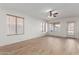 Bright living room featuring hardwood floors and a ceiling fan at 4248 E Raven Rd, Phoenix, AZ 85044