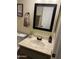 Bathroom with vanity, sink, and framed mirror at 455 S Delaware Dr # 117, Apache Junction, AZ 85120