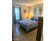 Spacious bedroom with a queen-size bed and tiled floors at 455 S Delaware Dr # 117, Apache Junction, AZ 85120