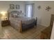 Bright bedroom with tiled floors and a double bed at 455 S Delaware Dr # 117, Apache Junction, AZ 85120