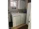 Laundry room with washer, dryer, and cabinets at 455 S Delaware Dr # 117, Apache Junction, AZ 85120