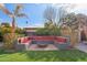 Cozy backyard with built-in seating and fire pit at 5013 W Orchid Ln, Glendale, AZ 85302