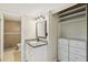 Bathroom with granite vanity and built-in storage at 5013 W Orchid Ln, Glendale, AZ 85302