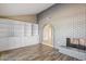 Living area with built-in shelving and a fireplace at 5013 W Orchid Ln, Glendale, AZ 85302