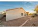 Backyard featuring gravel ground cover, stucco exterior, and brick garden edge at 505 W Wayland Dr, Phoenix, AZ 85041