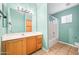 Bright bathroom featuring a shower/tub combo, and wood vanity at 505 W Wayland Dr, Phoenix, AZ 85041