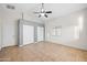 Spacious bedroom featuring neutral walls, a ceiling fan, and tile flooring at 505 W Wayland Dr, Phoenix, AZ 85041