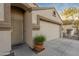 Close-up of a tan single-story house with garage, desert landscaping, and cozy front entrance at 505 W Wayland Dr, Phoenix, AZ 85041