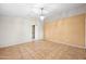 Spacious living room with tan walls, tile flooring and chandelier at 505 W Wayland Dr, Phoenix, AZ 85041