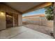 Covered patio with stained concrete, brick pavers, and sliding glass door at 505 W Wayland Dr, Phoenix, AZ 85041