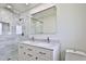 Modern bathroom with double vanity, marble countertops, and glass shower at 523 S Spencer St, Mesa, AZ 85204