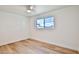 Bright bedroom with light flooring, ceiling fan, and large window at 523 S Spencer St, Mesa, AZ 85204