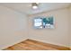 Bright bedroom with light flooring, ceiling fan, and large window at 523 S Spencer St, Mesa, AZ 85204