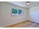 Bright bedroom with light flooring, ceiling fan, and window at 523 S Spencer St, Mesa, AZ 85204