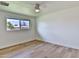 Bright bedroom with light flooring, ceiling fan, and window at 523 S Spencer St, Mesa, AZ 85204