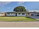 Newly renovated single story home with a spacious front yard and carport at 523 S Spencer St, Mesa, AZ 85204