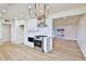 Bright kitchen features white shaker cabinets, quartz countertops, and stainless steel appliances at 523 S Spencer St, Mesa, AZ 85204