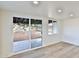 Living area with sliding glass doors leading to the backyard patio at 523 S Spencer St, Mesa, AZ 85204