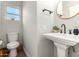 Simple bathroom with pedestal sink and toilet at 533 W Oregon Ave, Phoenix, AZ 85013