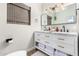 Stylish bathroom with a double vanity and marble countertop at 533 W Oregon Ave, Phoenix, AZ 85013