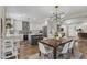 Bright dining area with wood table and white chairs, adjacent to the kitchen at 533 W Oregon Ave, Phoenix, AZ 85013