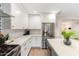 Sleek kitchen with stainless steel appliances and white cabinetry at 533 W Oregon Ave, Phoenix, AZ 85013