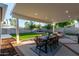 Covered patio with seating area and dining table at 533 W Oregon Ave, Phoenix, AZ 85013