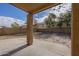 Landscaped backyard with patio and rock border at 5427 W St Kateri Dr, Laveen, AZ 85339