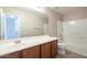 Clean bathroom, featuring a vanity and shower/tub combo at 5427 W St Kateri Dr, Laveen, AZ 85339