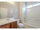 Clean bathroom with tub shower, vanity, and toilet at 5427 W St Kateri Dr, Laveen, AZ 85339