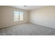 Bright bedroom with carpeted floor and large window at 5427 W St Kateri Dr, Laveen, AZ 85339