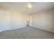 Spacious bedroom with neutral walls and carpeting at 5427 W St Kateri Dr, Laveen, AZ 85339