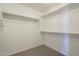 Walk-in closet with shelves and rods at 5427 W St Kateri Dr, Laveen, AZ 85339