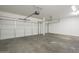 Two-car garage with automatic opener and concrete floor at 5427 W St Kateri Dr, Laveen, AZ 85339