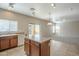 Open kitchen with island, tile floors, and view of Gathering room at 5427 W St Kateri Dr, Laveen, AZ 85339