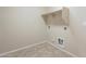 Laundry room with tile flooring and built-in shelving at 5427 W St Kateri Dr, Laveen, AZ 85339