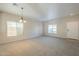 Open living area with light walls and carpeting at 5427 W St Kateri Dr, Laveen, AZ 85339