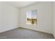 Bright bedroom with carpet and window overlooking landscape at 5509 N 193Rd Ave, Litchfield Park, AZ 85340