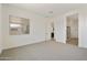 Main bedroom with carpet, access to bathroom and ensuite at 5509 N 193Rd Ave, Litchfield Park, AZ 85340