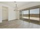 Bright dining room with sliding glass doors leading to backyard at 5509 N 193Rd Ave, Litchfield Park, AZ 85340